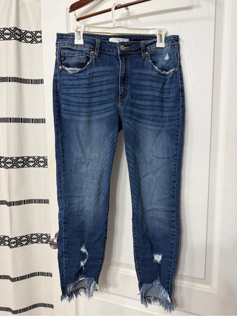 KanCan jeans in size 13/30 feature a raw hem and destroyed detailing